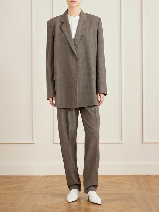 Image of a model wearing Pants. Product name - Gregori Wool Wide-leg Pants in Green colour by brand - The Row