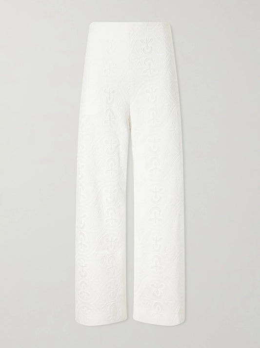 Image of a model wearing Pants. Product name - Nynette Floral-embroidered Cotton-blend Wide-leg Pants in White colour by brand - TOVE