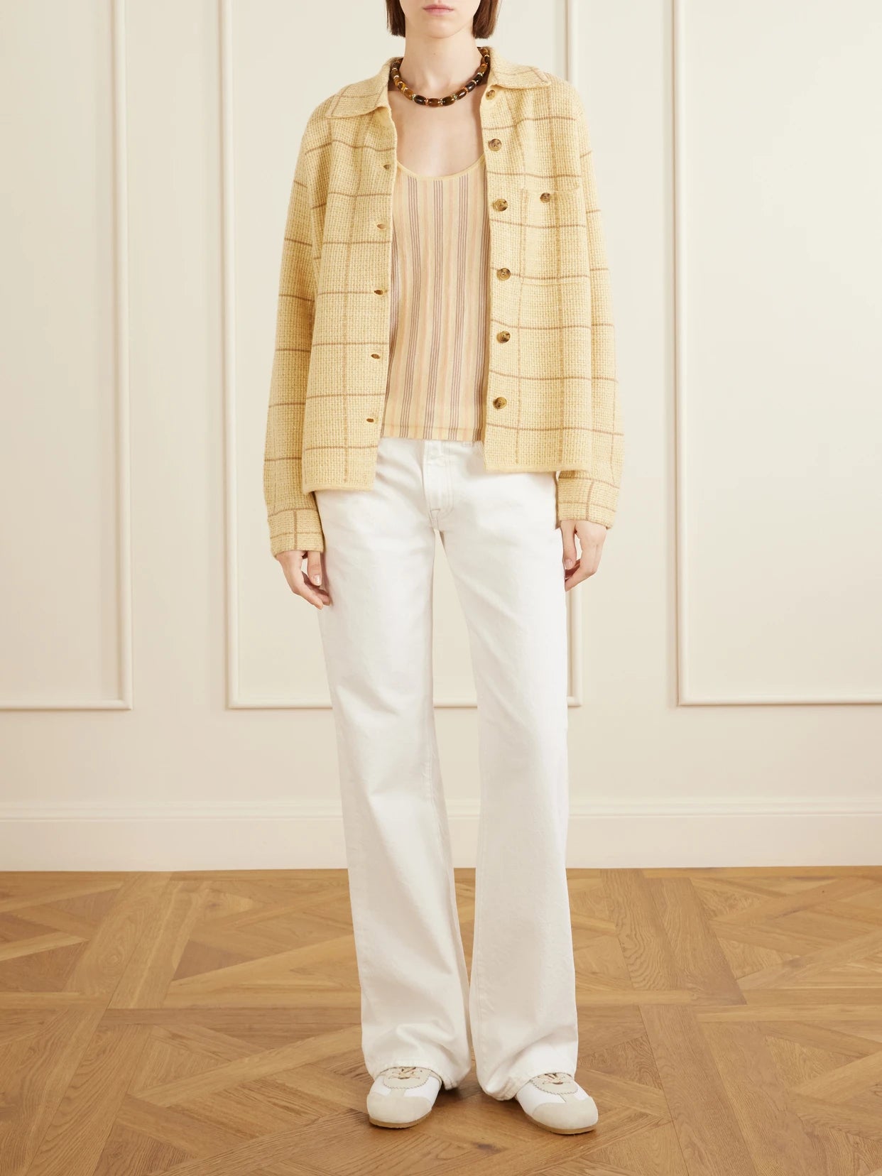 Image of a model wearing Tops. Product name - Striped Cashmere Tank in Yellow colour by brand - Guest In Residence