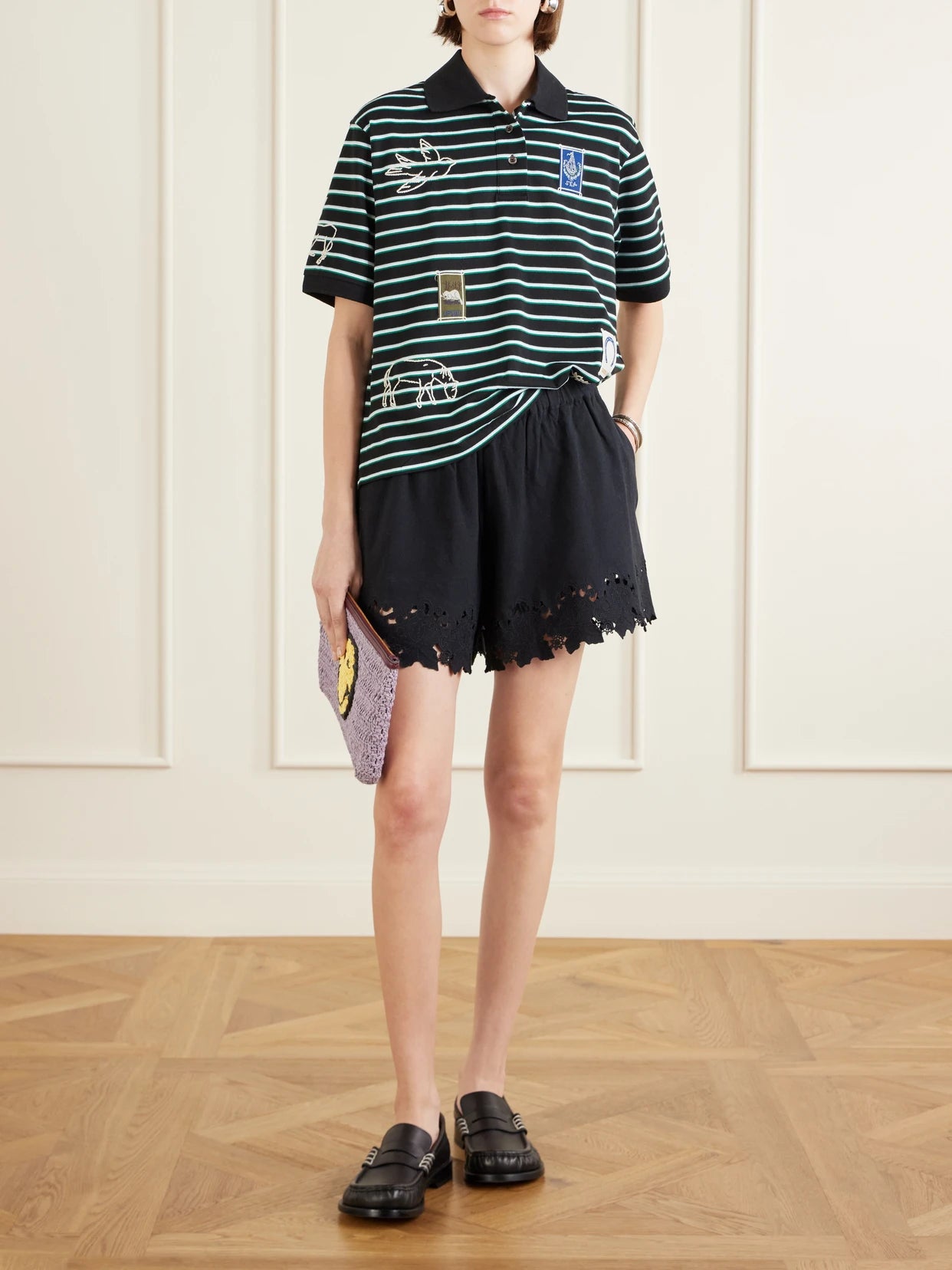 Image of a model wearing Shorts. Product name - Eleannora Embroidered Cotton And Linen-blend Shorts in Black colour by brand - Sea