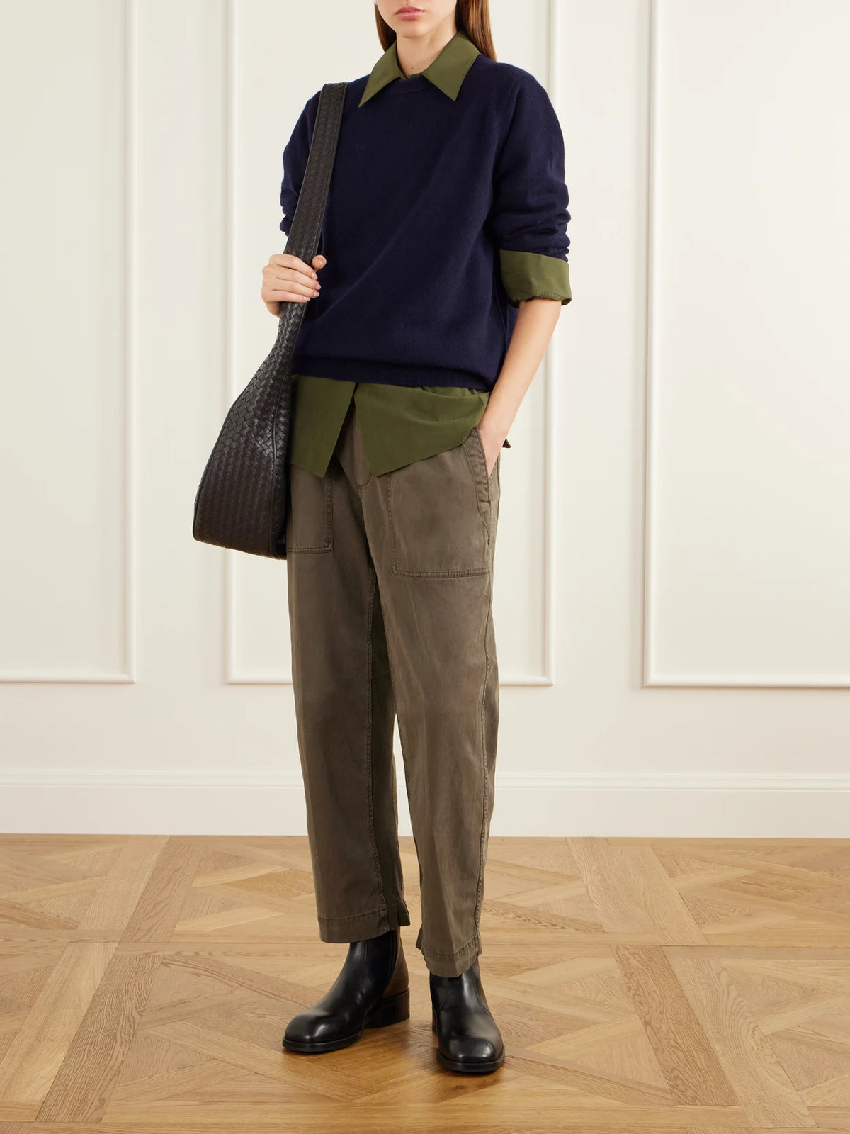 Image of a model wearing Pants. Product name - Rib-trimmed Cotton-twill Tapered Pants in Army green, Black colour by brand - James Perse