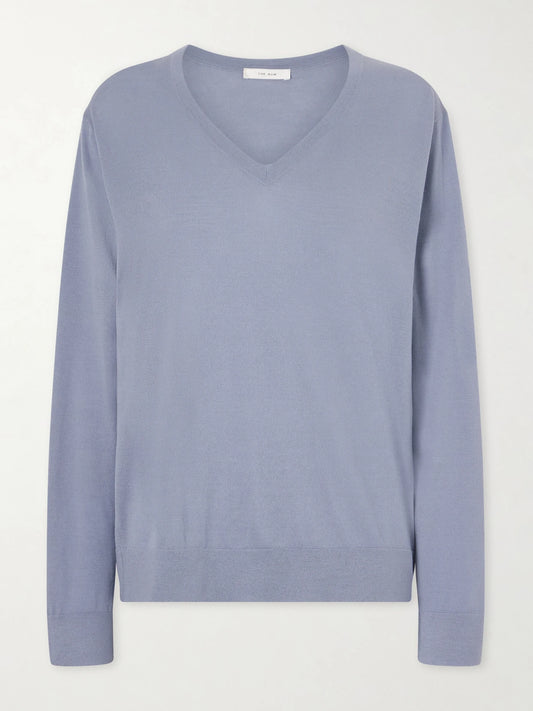 Image of a model wearing Outerwear. Product name - Naius Wool Sweater in Light blue colour by brand - The Row