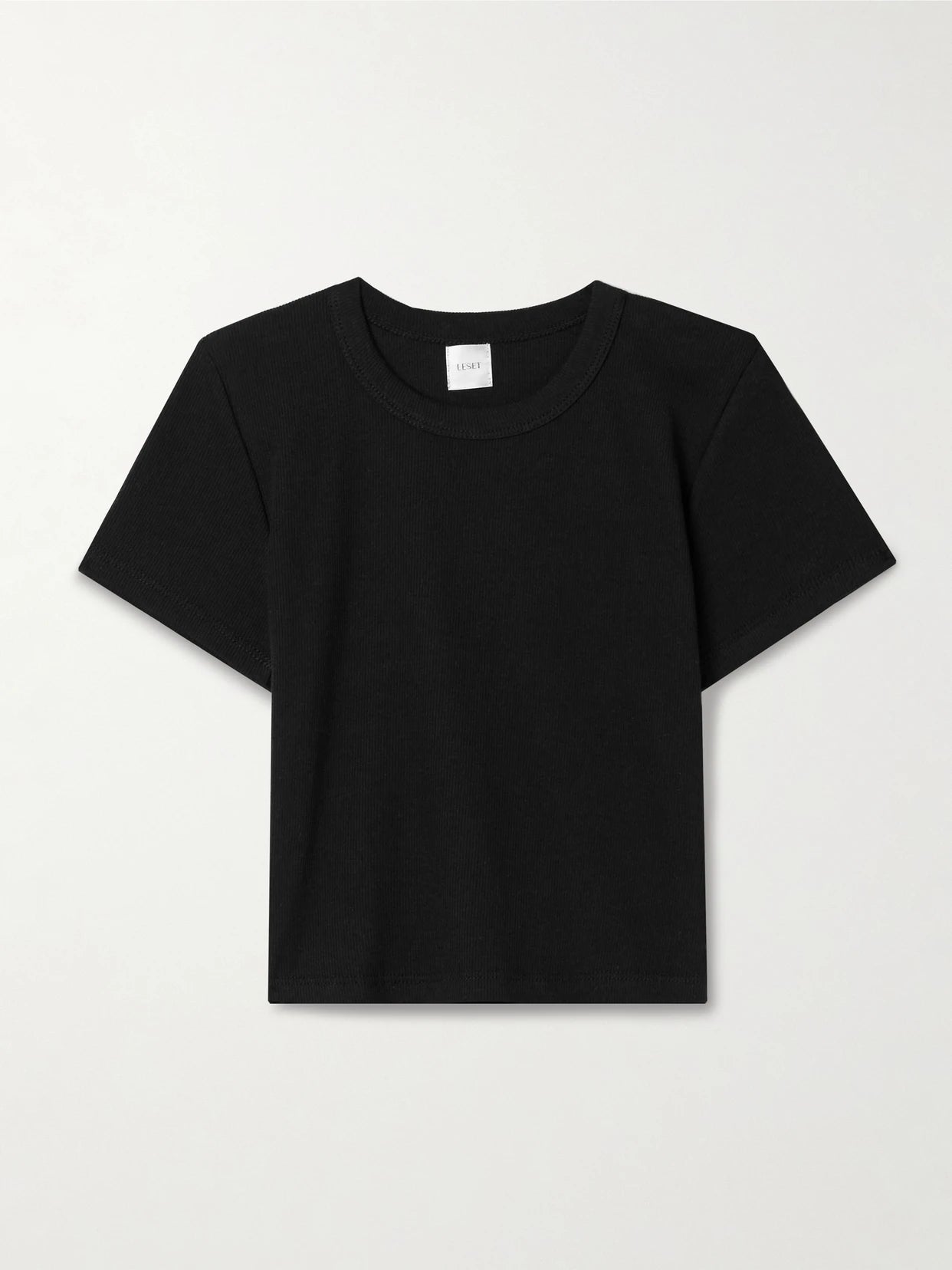 Image of a model wearing Tops. Product name - Kelly Cropped Ribbed Stretch-cotton Jersey T-shirt in Black colour by brand - LESET