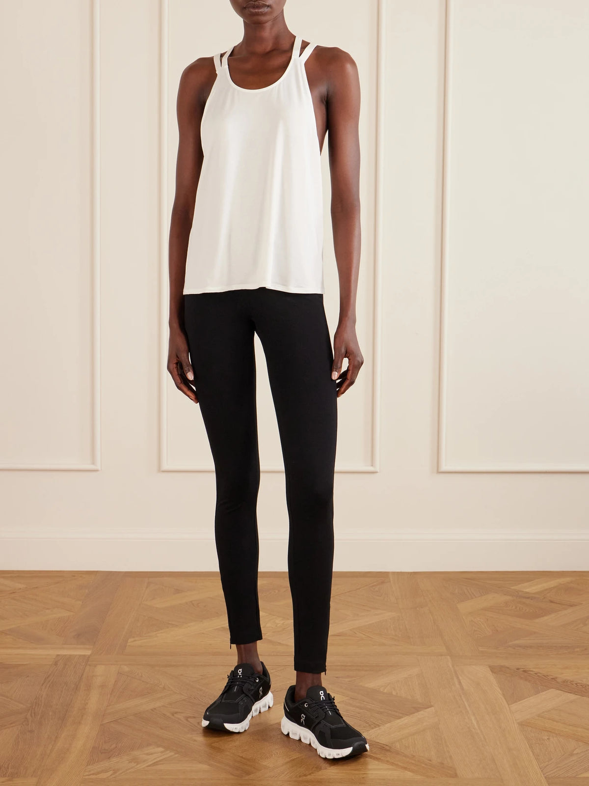 Image of a model wearing Tops. Product name - Allyson Embroidered Stretch Jersey Tank Top in White colour by brand - Eres