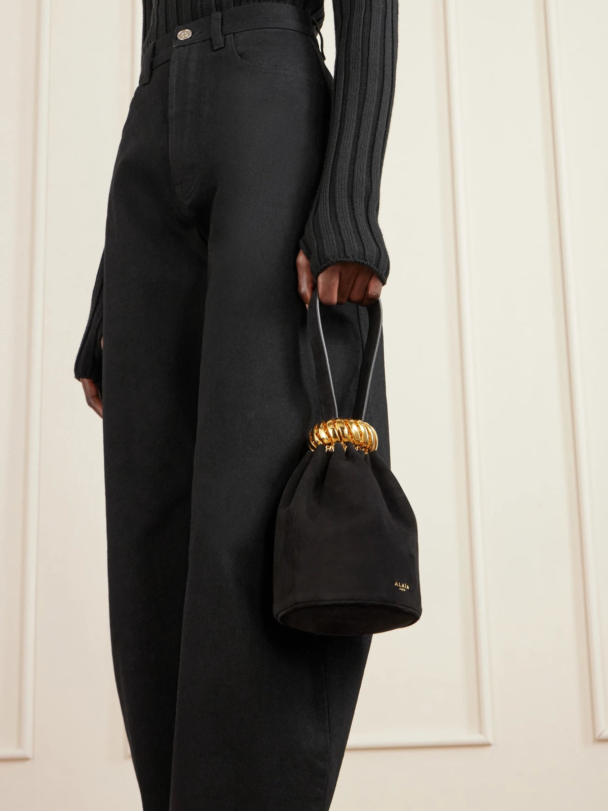 Image of Bags. Product name - Leather And Gold-tone Trimmed Suede Bucket Bag in Black colour by brand - Alaïa