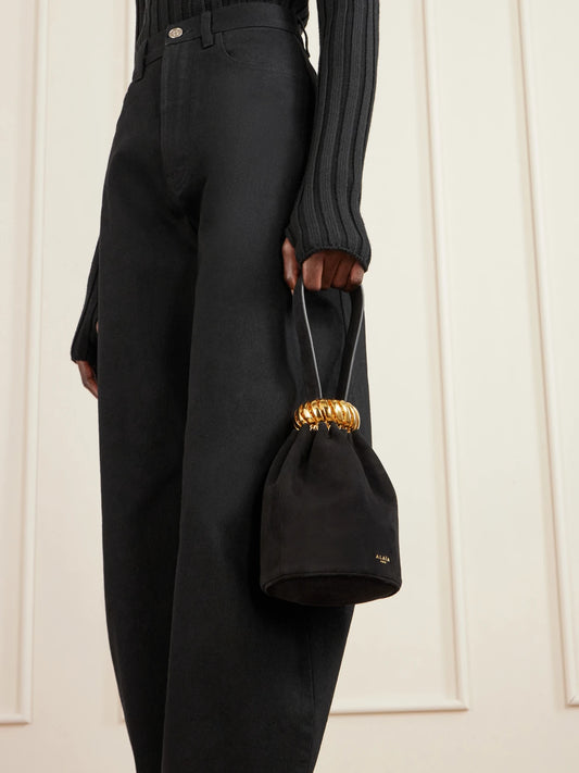 Image of Bags. Product name - Leather And Gold-tone Trimmed Suede Bucket Bag in Black colour by brand - Alaïa