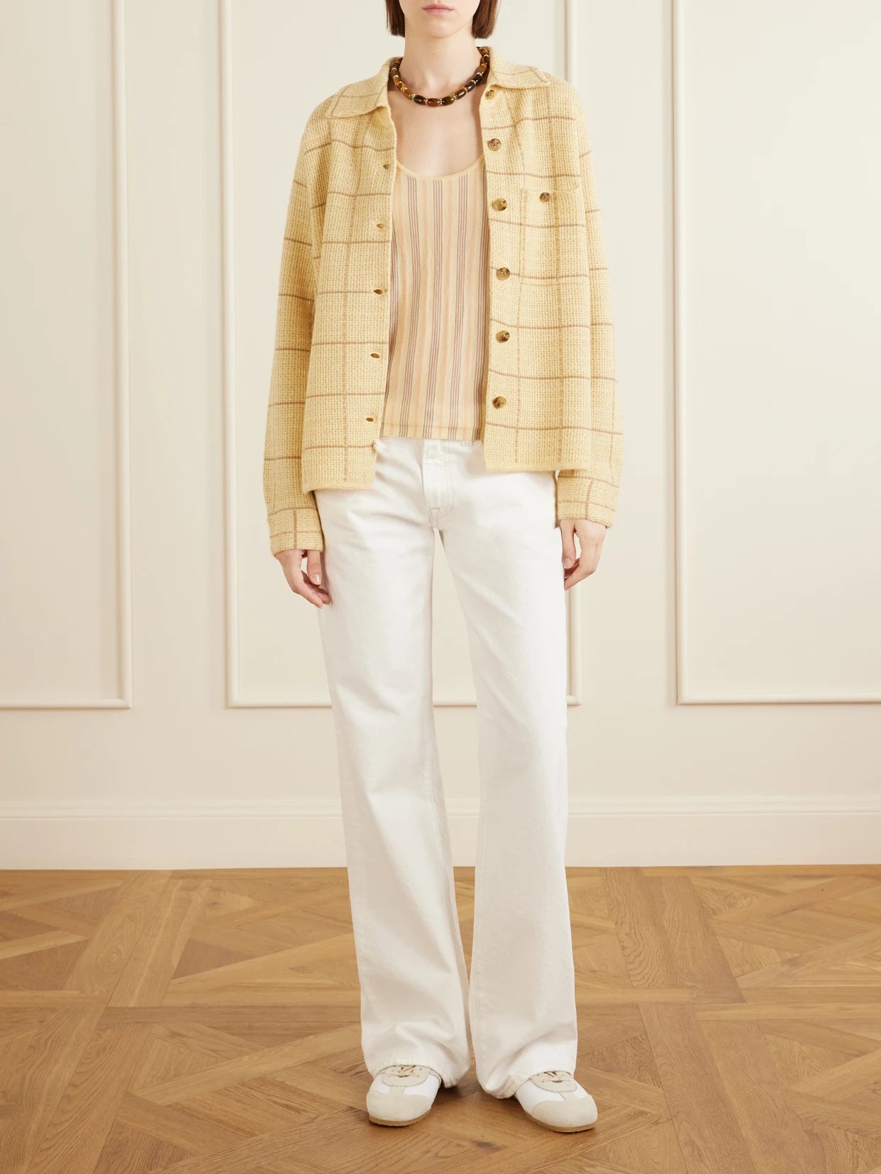 Image of a model wearing Tops. Product name - Dylan Checked Knitted Cashmere And Linen-blend Shirt in Yellow colour by brand - Guest In Residence