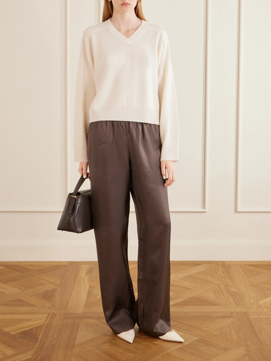 Image of a model wearing Outerwear. Product name - Anzor Cashmere Sweater in Ivory colour by brand - Loulou de Saison