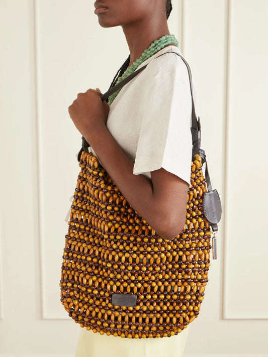 Image of Bags. Product name - Drift Leather-trimmed Beaded Wood Shoulder Bag in Brown colour by brand - STAUD