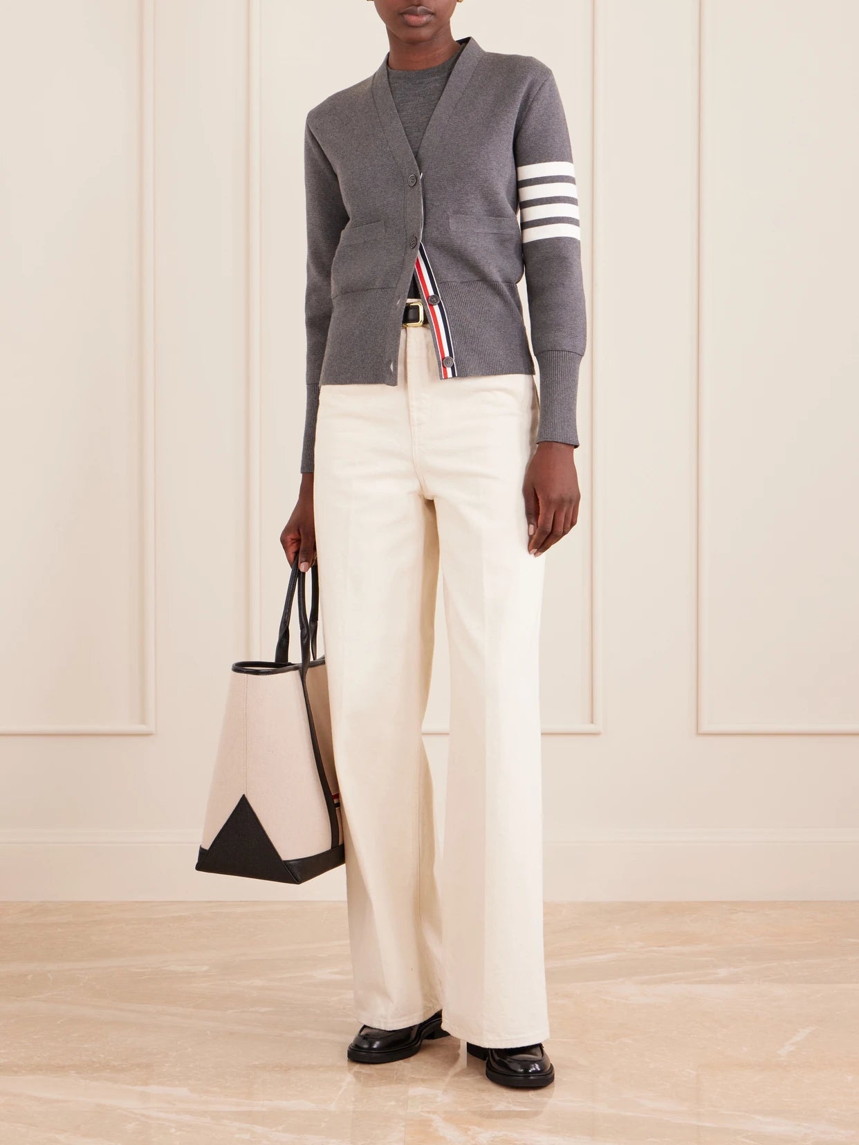 Image of a model wearing Outerwear. Product name - Grosgrain-trimmed Striped Cotton Cardigan in Gray colour by brand - Thom Browne