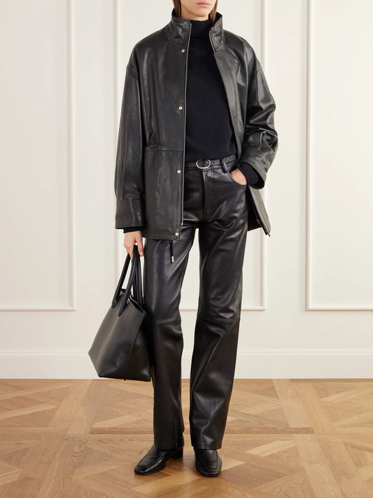 Image of a model wearing Pants. Product name - Jean Paneled Leather Straight-leg Pants in Black colour by brand - ARMA