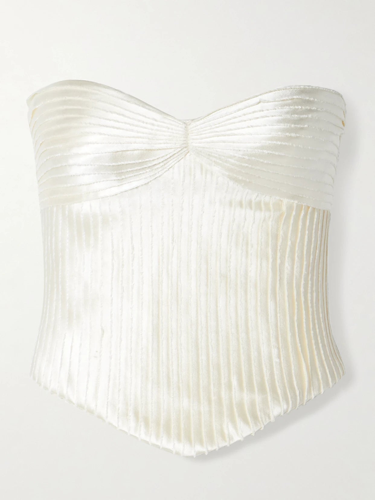 Image of a model wearing Tops. Product name - Ella Strapless Frayed Pintucked Silk And Wool-blend Satin Bustier Top in Off-white colour by brand - Danielle Frankel