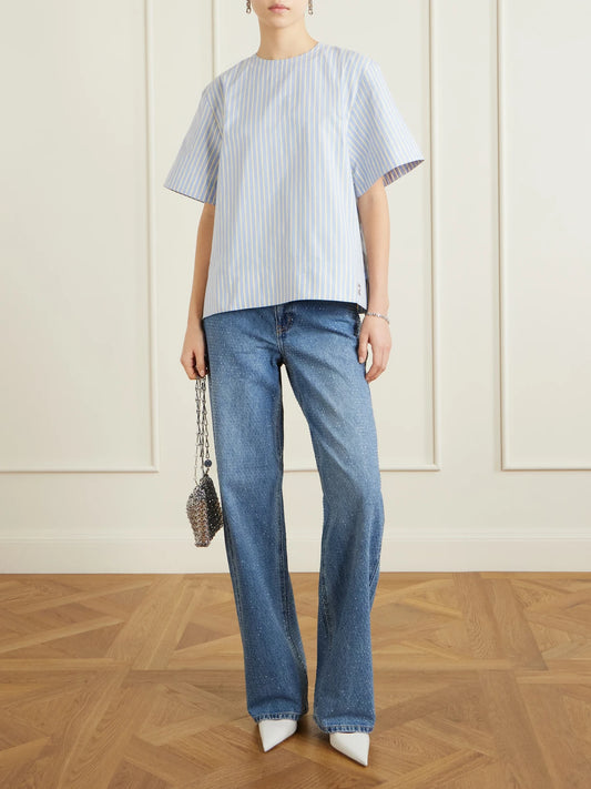 Image of a model wearing Tops. Product name - Striped Cotton-poplin T-shirt in Blue colour by brand - RABANNE