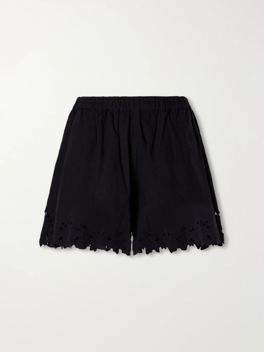 Image of a model wearing Shorts. Product name - Eleannora Embroidered Cotton And Linen-blend Shorts in Black colour by brand - Sea