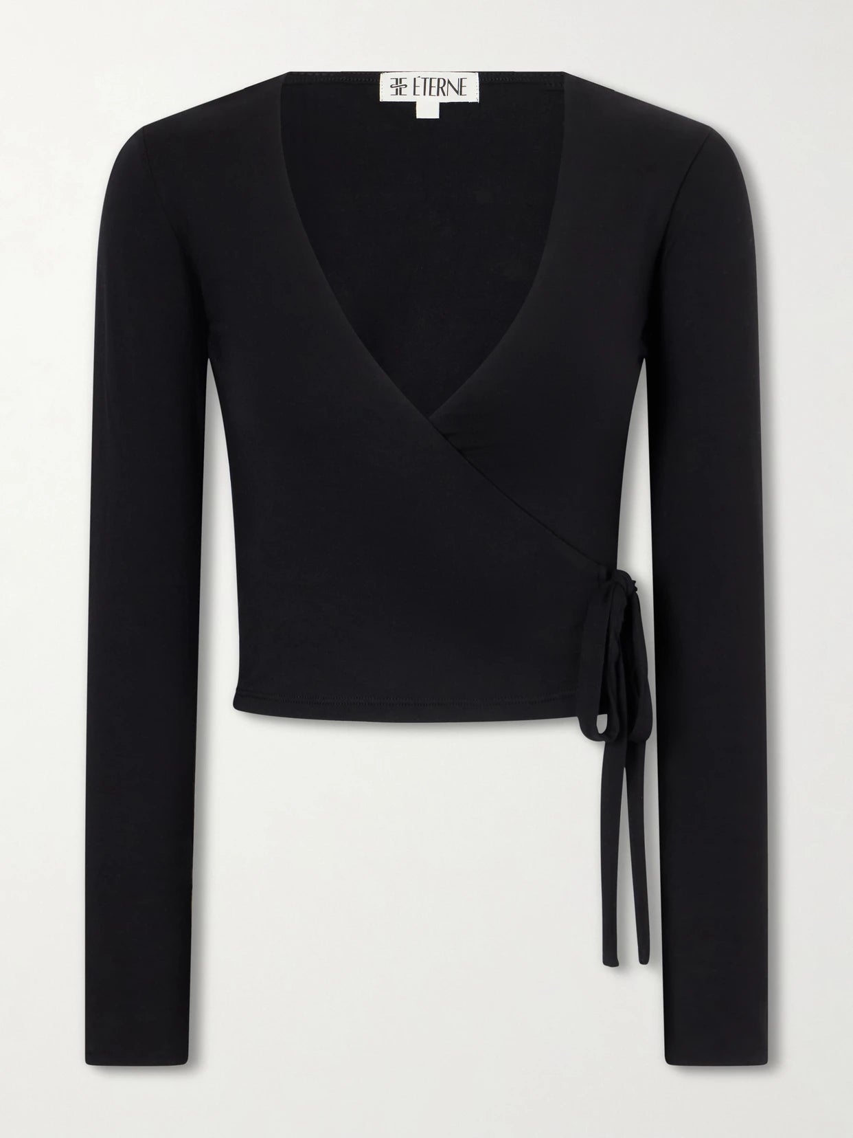 Image of a model wearing Tops. Product name - Wrap Jersey T-shirt in Black colour by brand - ÉTERNE