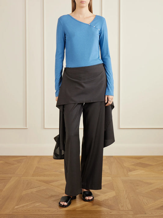 Image of a model wearing Tops. Product name - Button-detail Ribbed Lyocell And Wool-blend T-shirt in Blue colour by brand - Deiji Studios