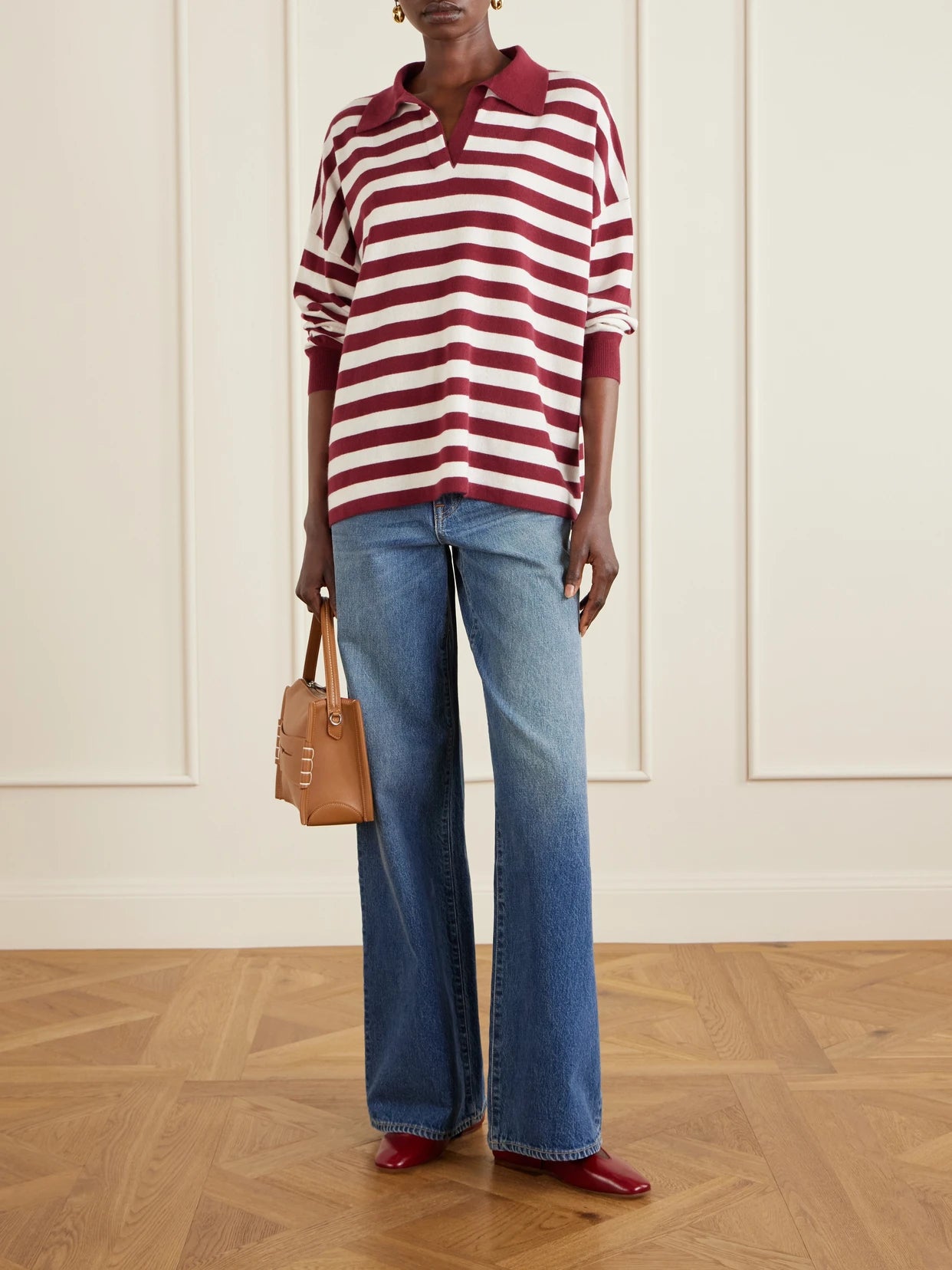Image of a model wearing Outerwear. Product name - Victoria Striped Cashmere Polo Shirt in Burgundy colour by brand - Arch4