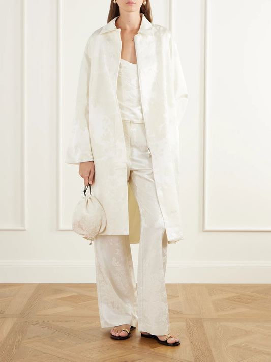 Image of a model wearing Pants. Product name - Wool And Silk-blend Floral-jacquard Cloqué Wide-leg Pants in Cream colour by brand - ST. AGNI