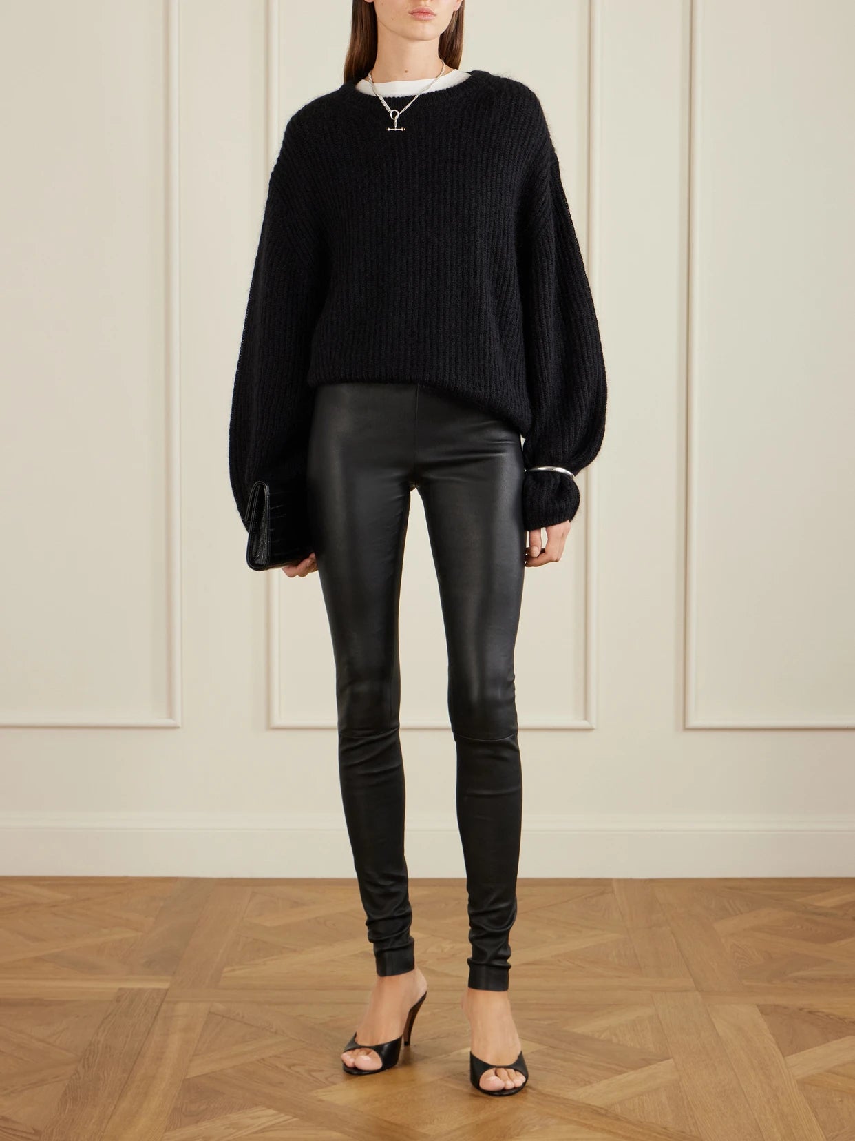 Image of a model wearing Pants. Product name - Carolyn Leather Leggings in Black colour by brand - STOULS