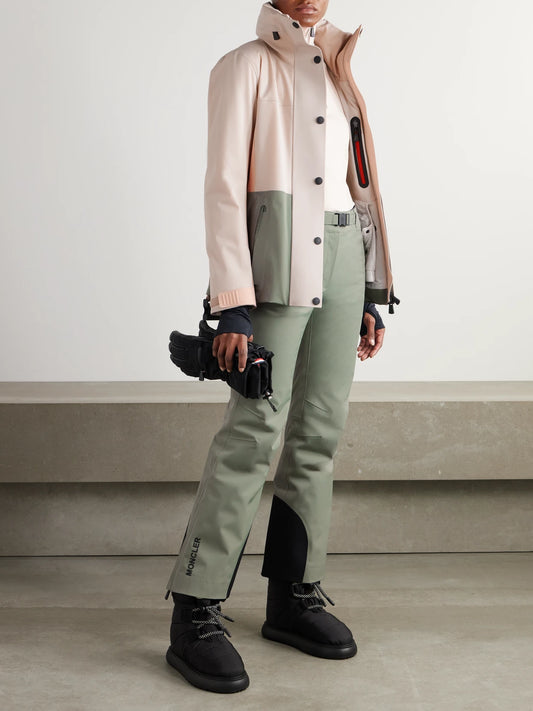 Image of a model wearing Pants. Product name - Belted Ski Pants in Sage green colour by brand - Moncler Grenoble