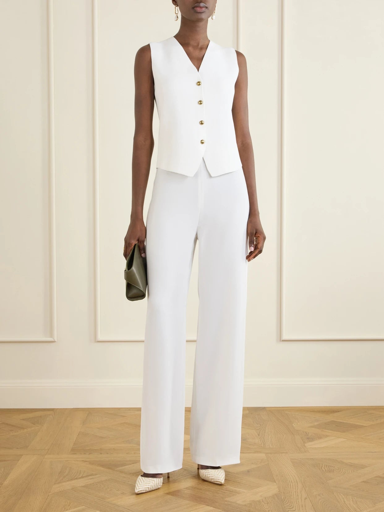 Image of a model wearing Tops. Product name - Gola Grain De Poudre Vest in White colour by brand - Max Mara