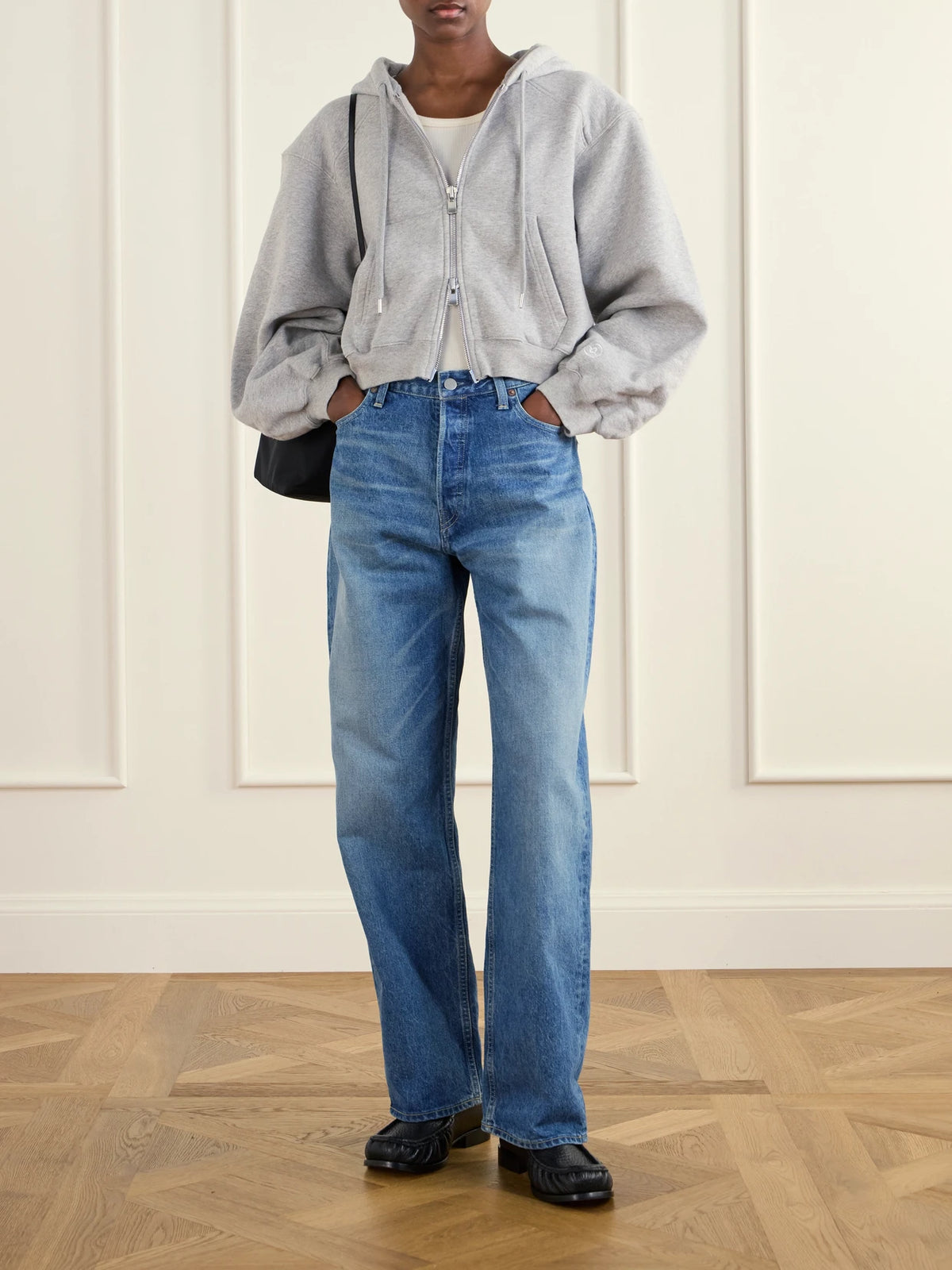 Image of a model wearing Tops. Product name - The Augustine Organic Cotton-jersey Hoodie in Gray colour by brand - RÙADH