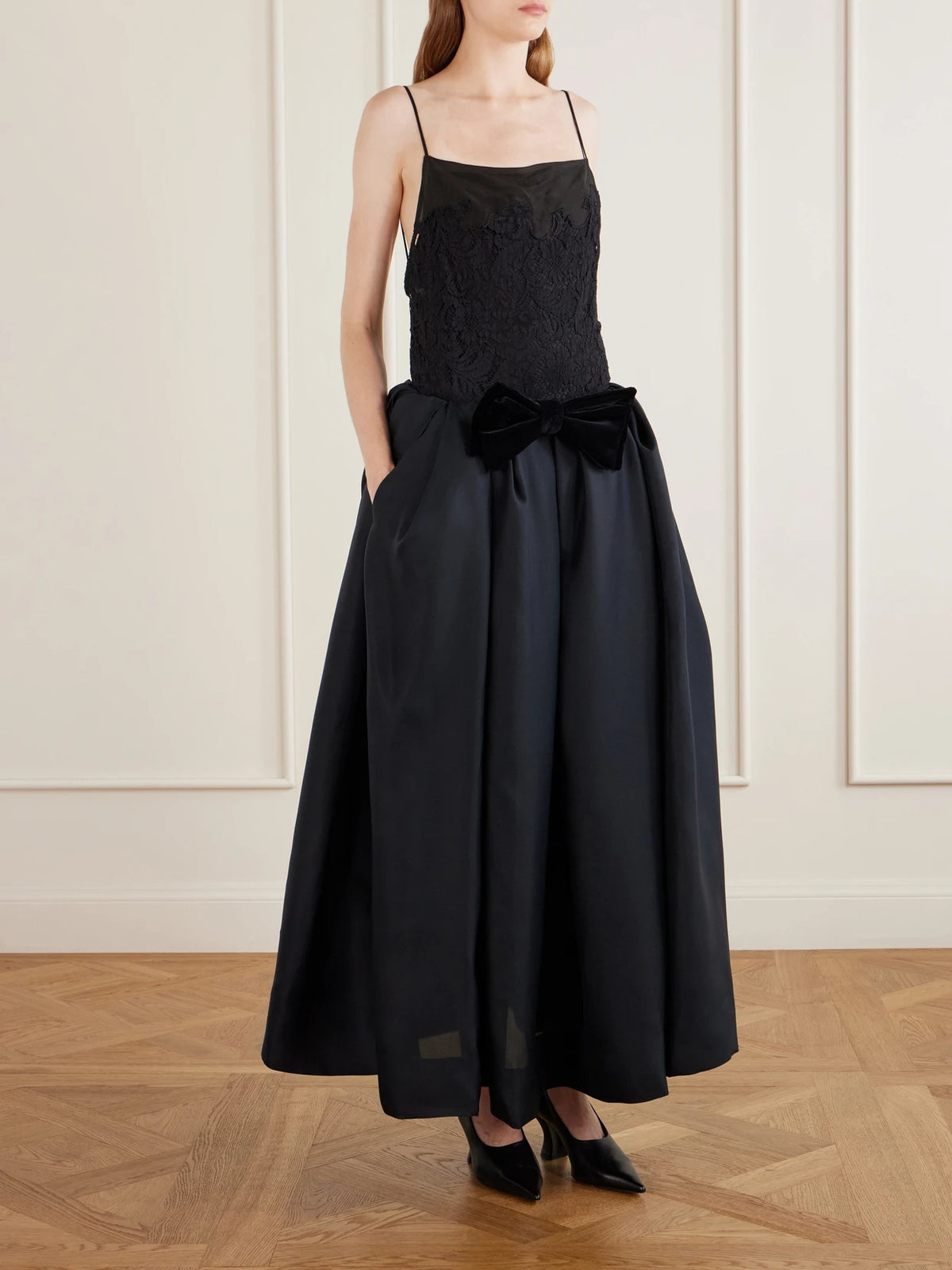 Image of a model wearing Skirts. Product name - Adara Sculptural Pleated Silk-twill Organza Maxi Skirt in Black colour by brand - KHAITE