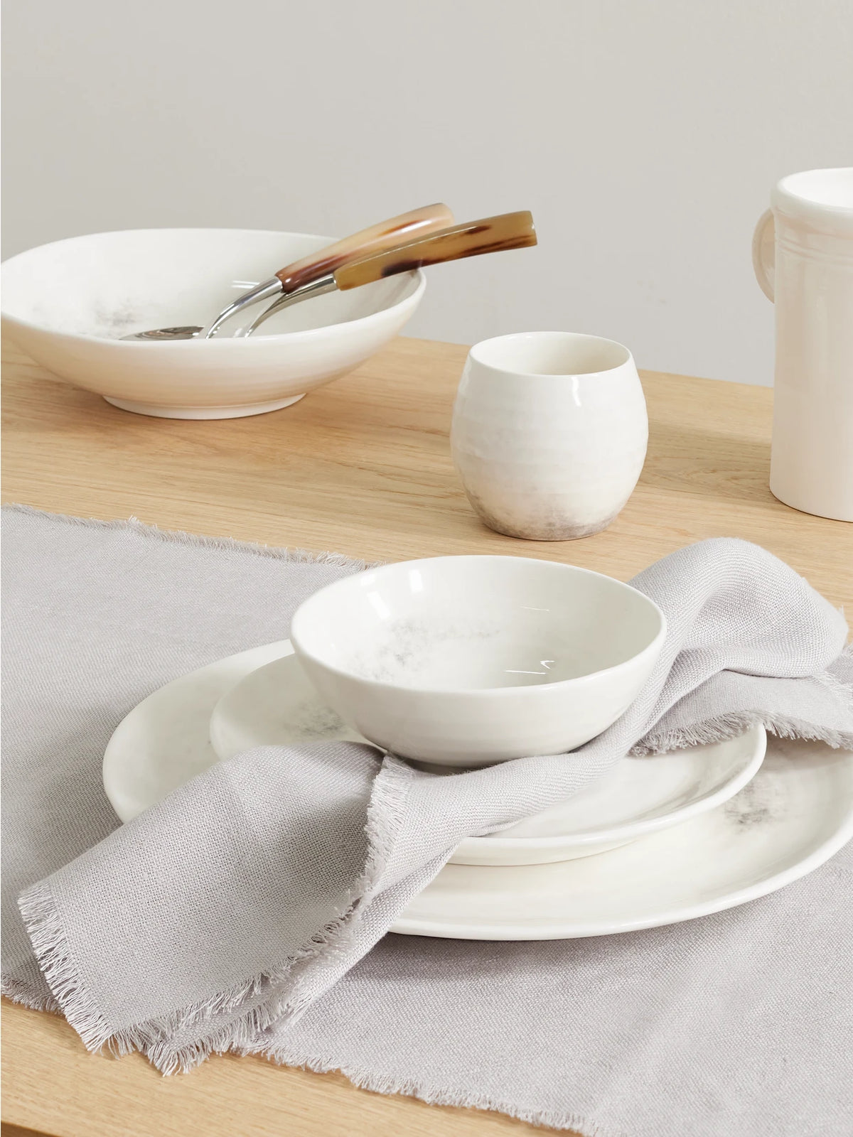 Image of Tableware. Product name - Frayed Linen Placemat And Napkin Set in Light gray colour by brand - Brunello Cucinelli