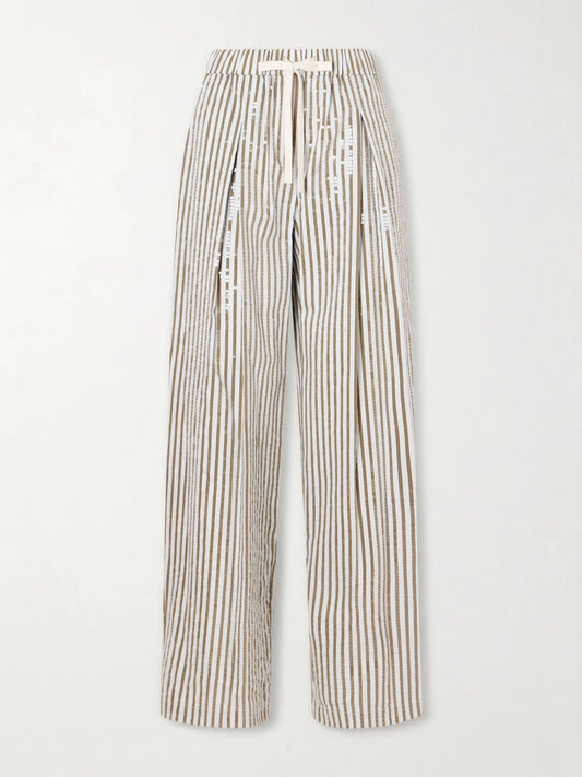 Image of a model wearing Pants. Product name - Pj Sequin-trimmed Striped Cotton-blend Wide-leg Drawstring Pants in Multi colour by brand - TWP