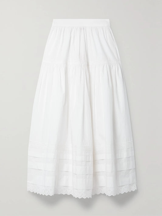 Image of a model wearing Skirts. Product name - Sebastiane Broderie Anglaise-trimmed Organic Cotton-poplin Midi Skirt in White colour by brand - DÔEN