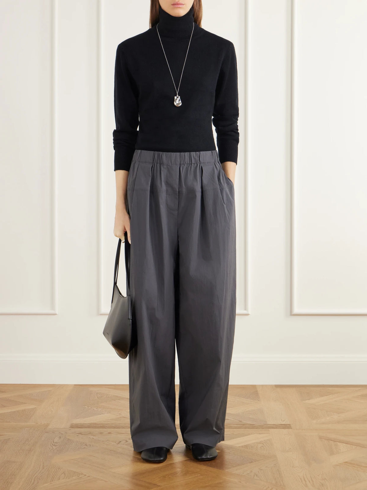 Image of a model wearing Outerwear. Product name - Wool And Cashmere-blend Turtleneck Bodysuit in Black colour by brand - Allude