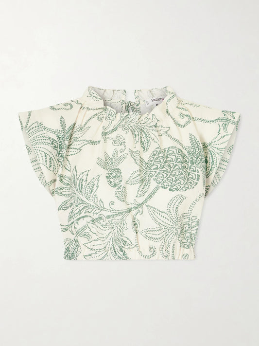 Image of a model wearing Tops. Product name - Muna Cropped Ruched Printed Linen Top in Green colour by brand - lemlem