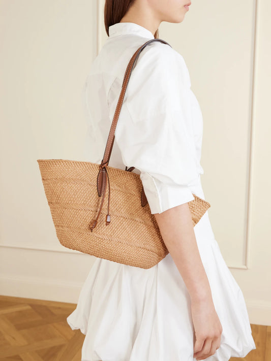 Image of Bags. Product name - Trapeze Basket Leather-trimmed Raffia Tote in Tan colour by brand - Hunting Season