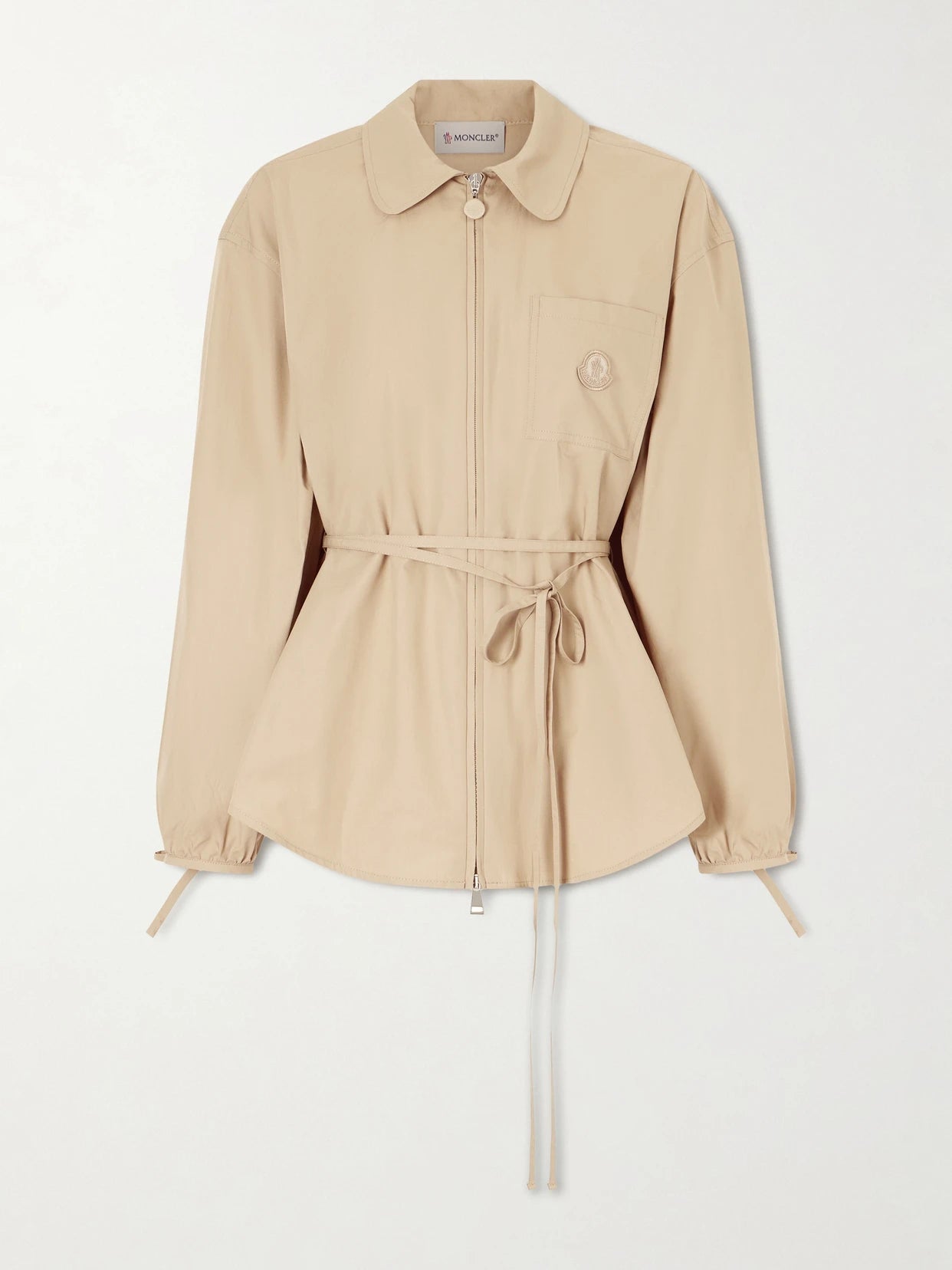 Image of a model wearing Tops. Product name - Belted Appliquéd Cotton-poplin Zip-up Shirt in Camel colour by brand - Moncler