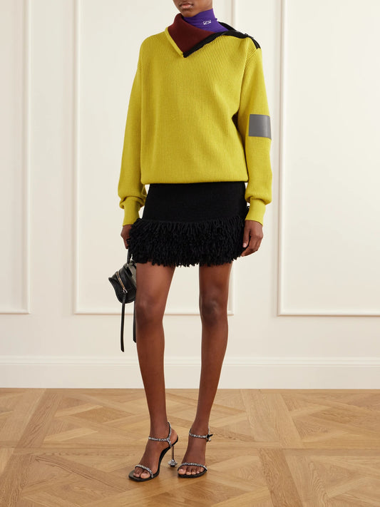 Image of a model wearing Skirts. Product name - Fringed Wool-blend Mini Skirt in Black colour by brand - LOEWE