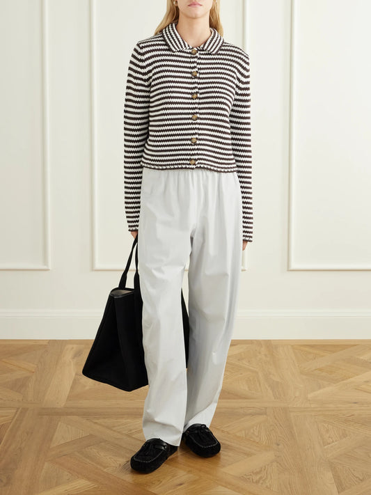 Image of a model wearing Outerwear. Product name - Mini Marina Cropped Striped Cotton Cardigan in Chocolate colour by brand - La Ligne