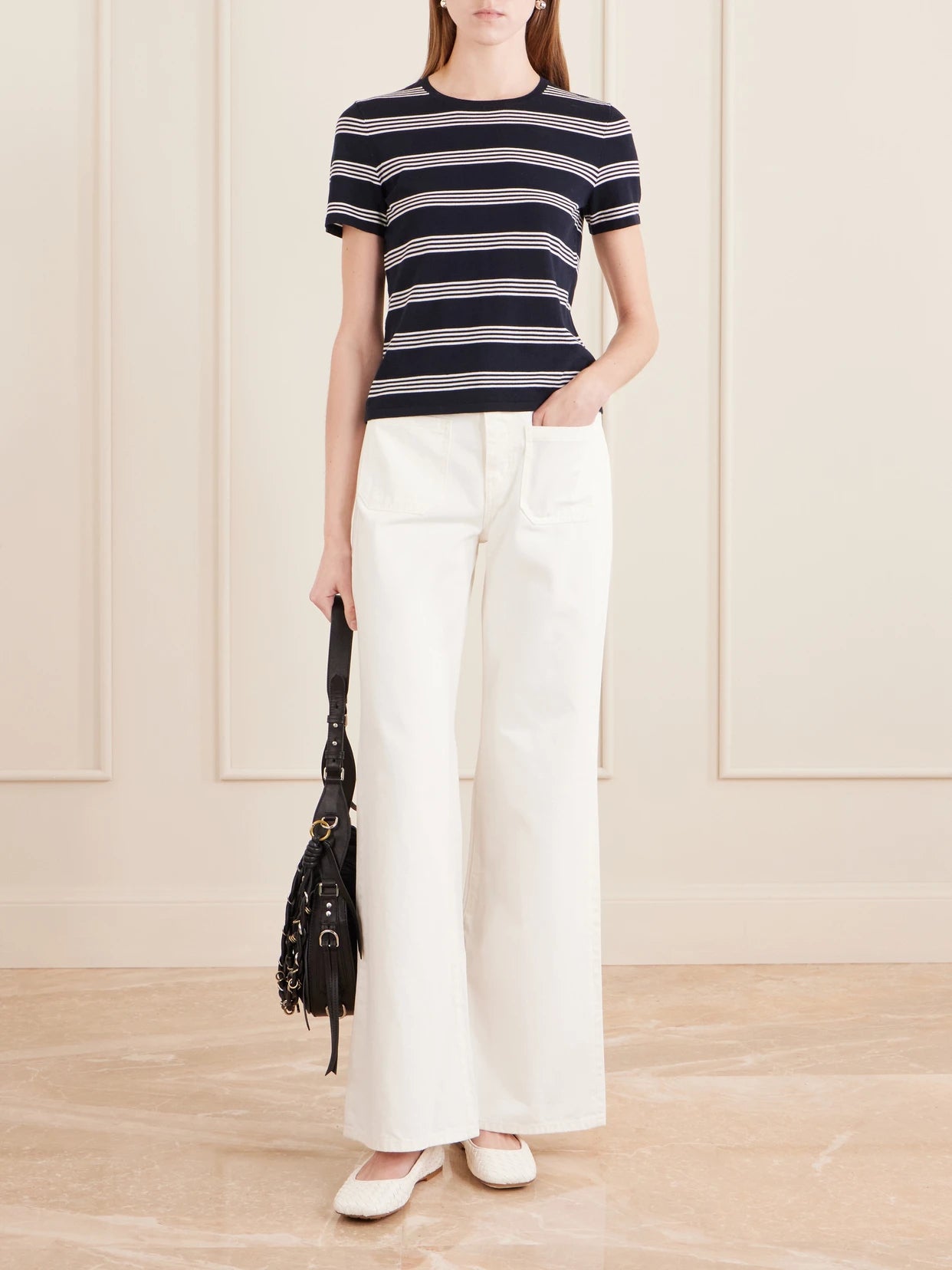 Image of a model wearing Tops. Product name - Lansie Striped Cotton-jersey T-shirt in Navy colour by brand - Nili Lotan