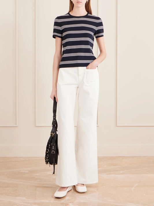 Image of a model wearing Tops. Product name - Lansie Striped Cotton-jersey T-shirt in Navy colour by brand - Nili Lotan