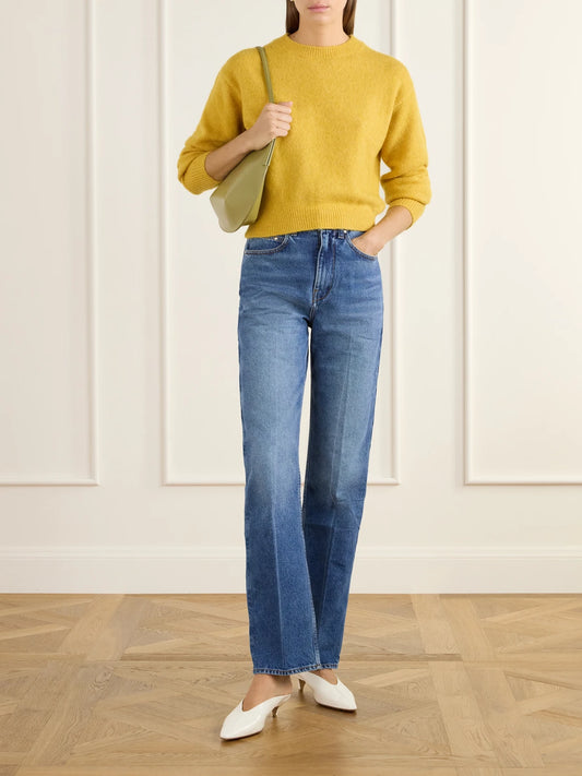 Image of a model wearing Outerwear. Product name - Ada Wool-blend Sweater in Mustard colour by brand - OSSOU