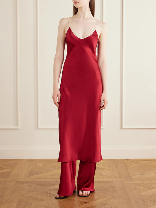 Image of a model wearing Pants. Product name - Silk-bias Pants in Red colour by brand - Comme Si