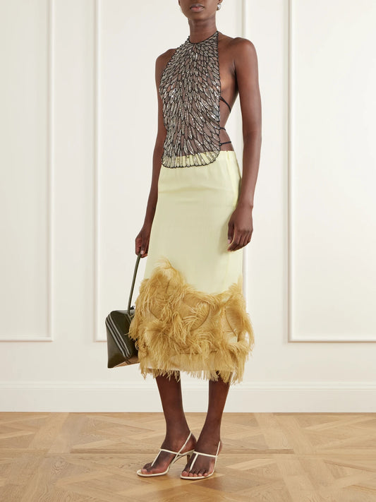 Image of a model wearing Tops. Product name - Tie-detailed Sequin-embellished Tulle Tank in Silver colour by brand - The Attico