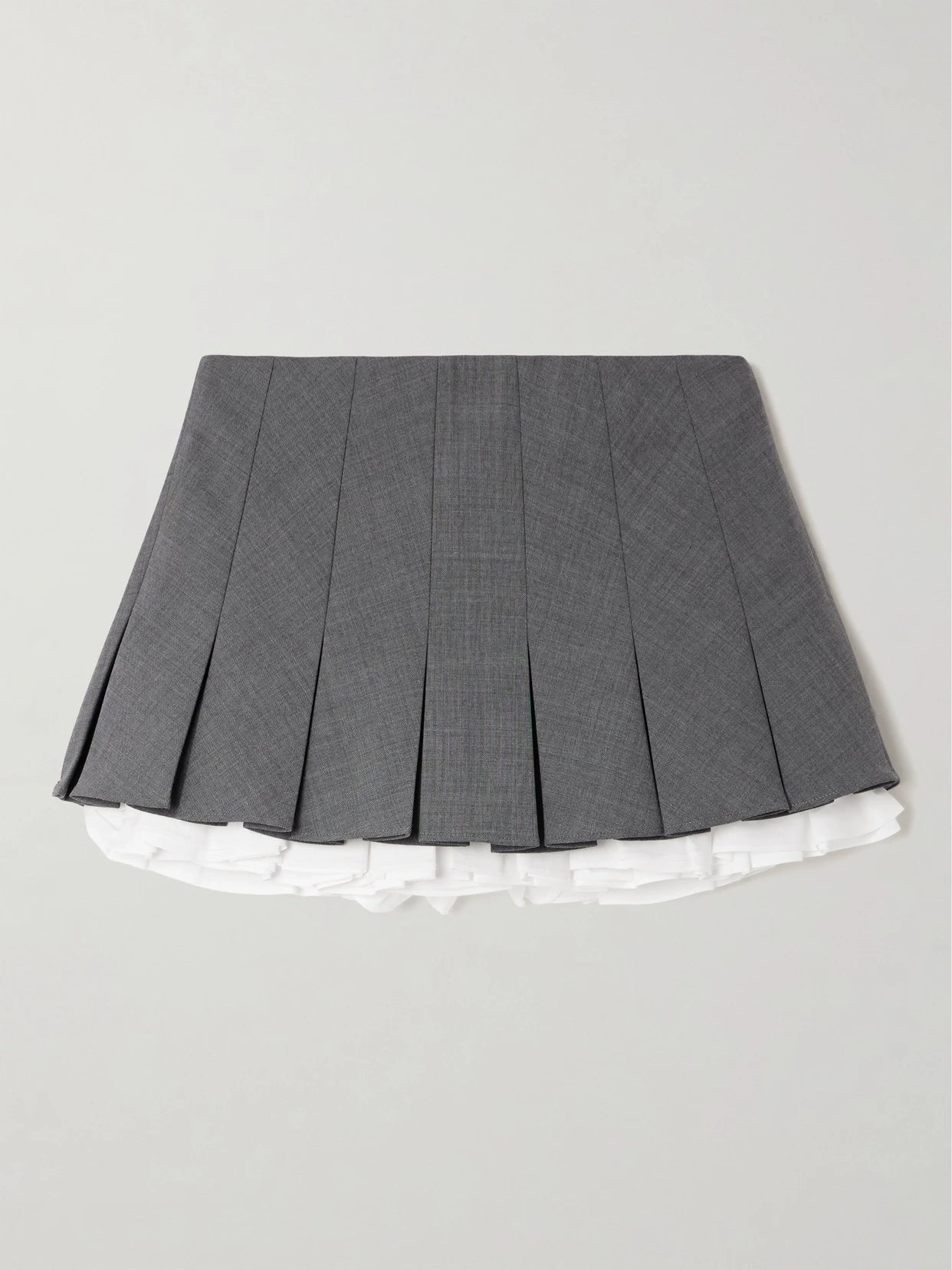 Image of a model wearing Skirts. Product name - Layered Pleated Cotton Poplin-trimmed Grain De Poudre Mini Skirt in Gray colour by brand - SHUSHU/TONG