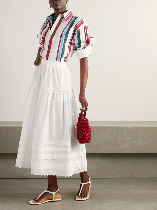 Image of a model wearing Skirts. Product name - Sebastiane Broderie Anglaise-trimmed Organic Cotton-poplin Midi Skirt in White colour by brand - DÔEN