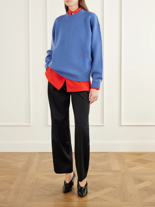 Image of a model wearing Outerwear. Product name - Logo-embroidered Wool Sweater in Blue colour by brand - Willy Chavarria