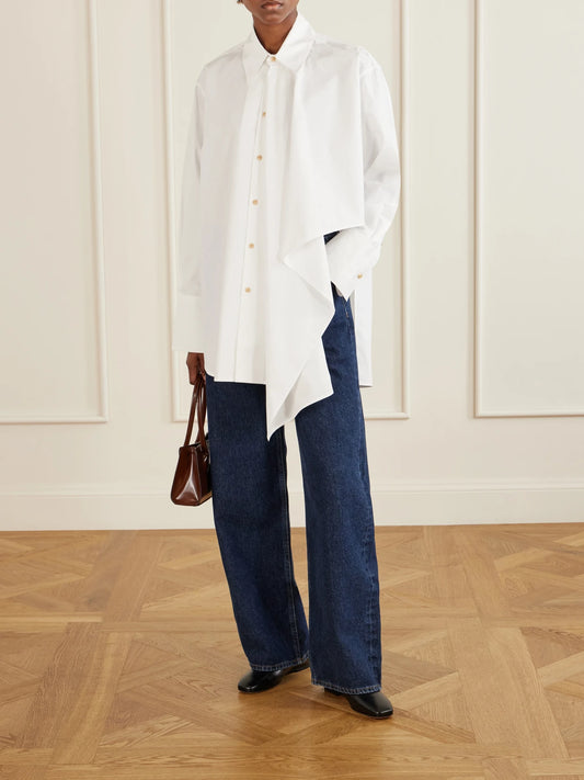 Image of a model wearing Tops. Product name - Tess Draped Cotton Poplin Shirt in Off-white colour by brand - OSSOU