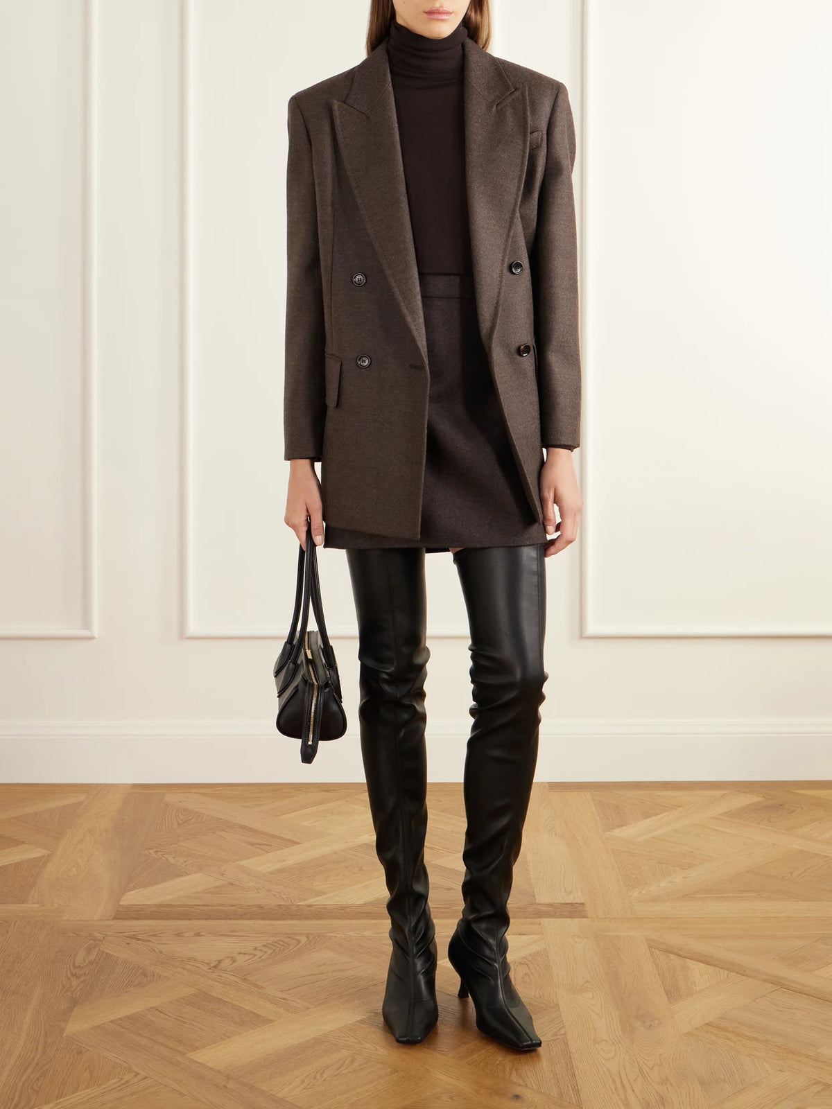 Image of a model wearing Skirts. Product name - Sacinoso Wool-felt Mini Skirt in Dark brown colour by brand - Max Mara