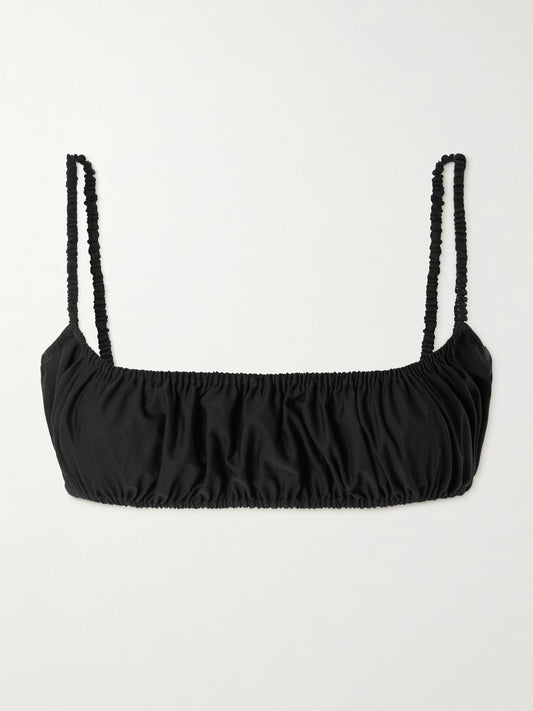 Image of a model wearing Tops. Product name - Gathered Cotton-poplin Bralette in Black colour by brand - Alaïa