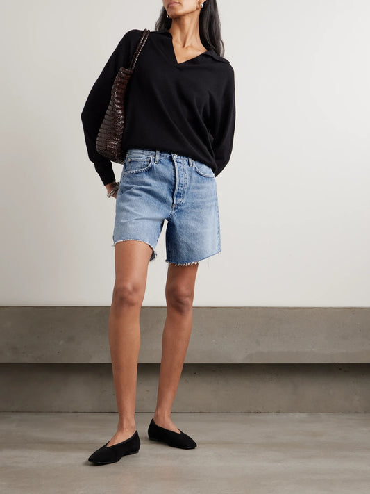 Image of a model wearing Shorts. Product name - Marlow Frayed Denim Shorts in Mid denim colour by brand - Citizens of Humanity