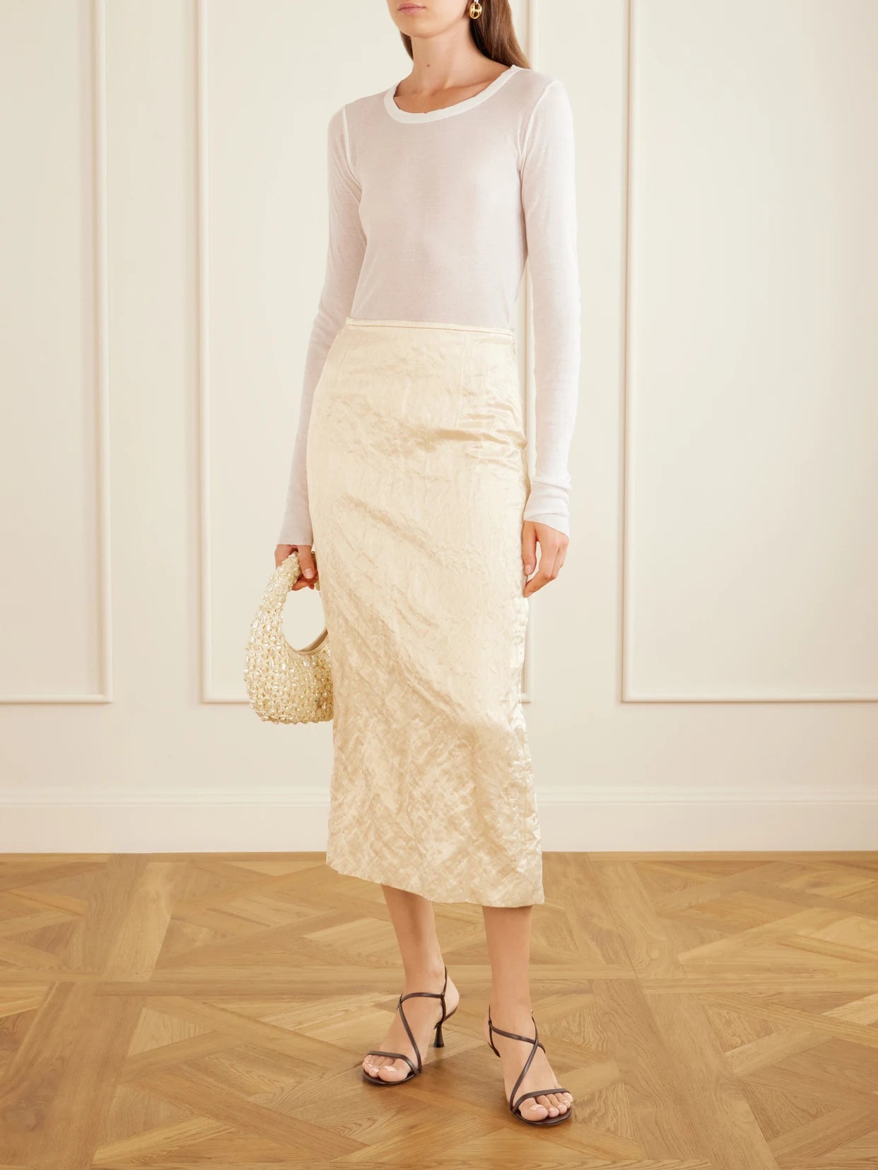 Image of a model wearing Skirts. Product name - Mena Cloqué Cotton-blend Midi Skirt in Ivory colour by brand - FFORME