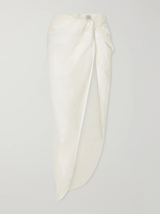 Image of a model wearing Skirts. Product name - Qaraya Light Linen Pareo Skirt in White colour by brand - Le Kasha